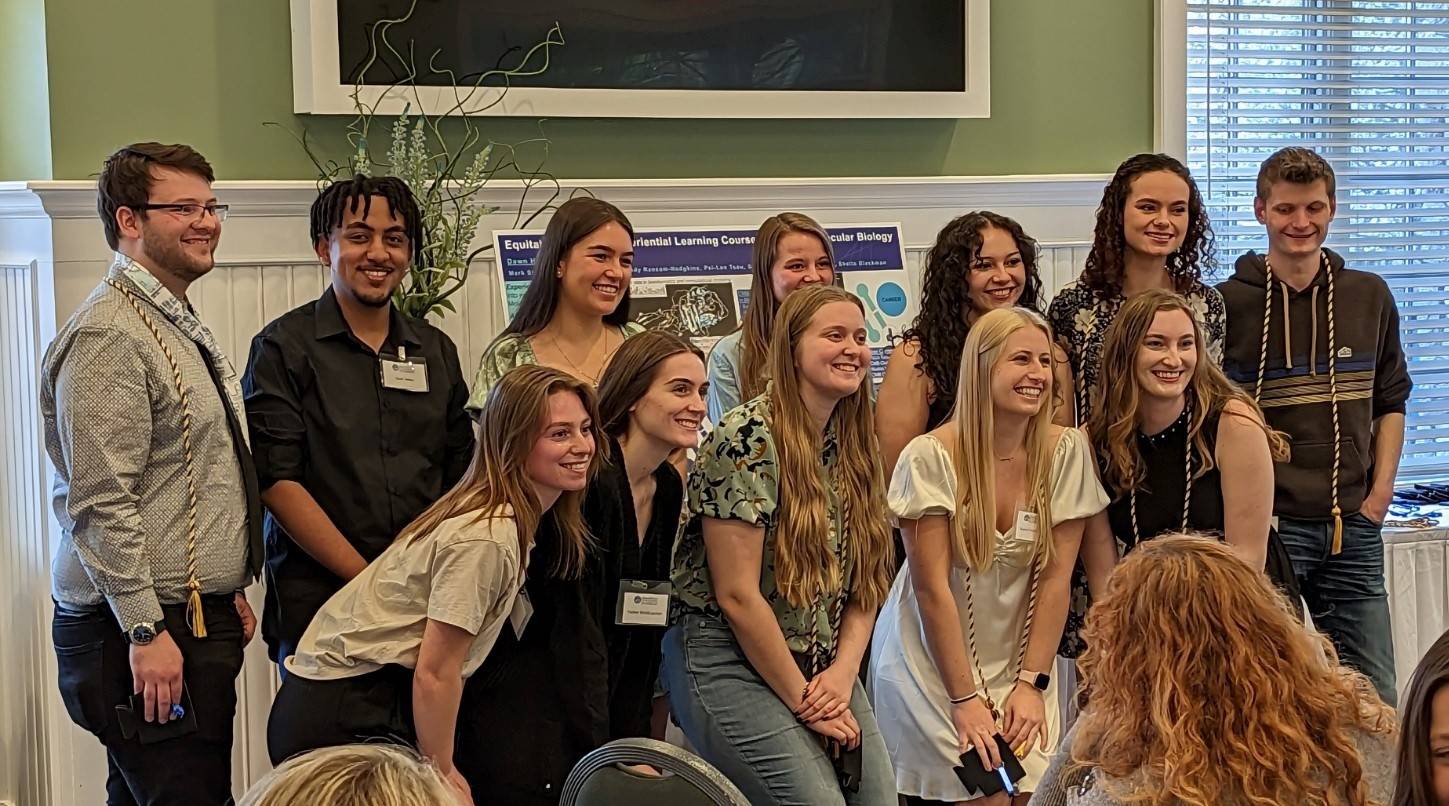 12 college students standing for photo